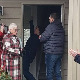 Woman excited to receive keys to new home