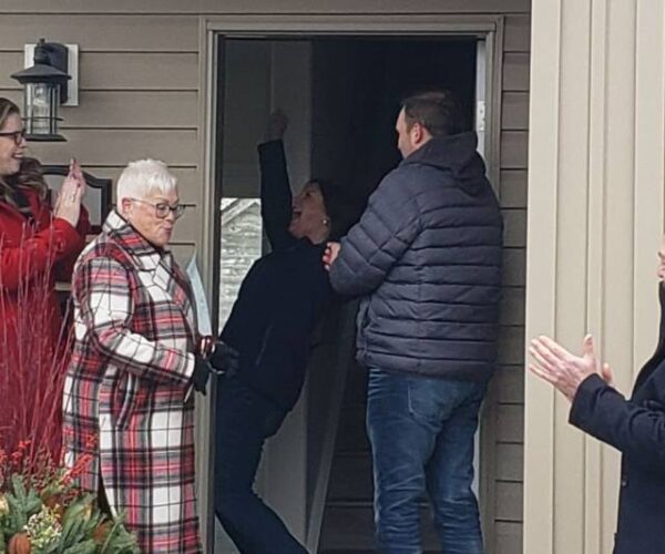 Woman excited to receive keys to new home